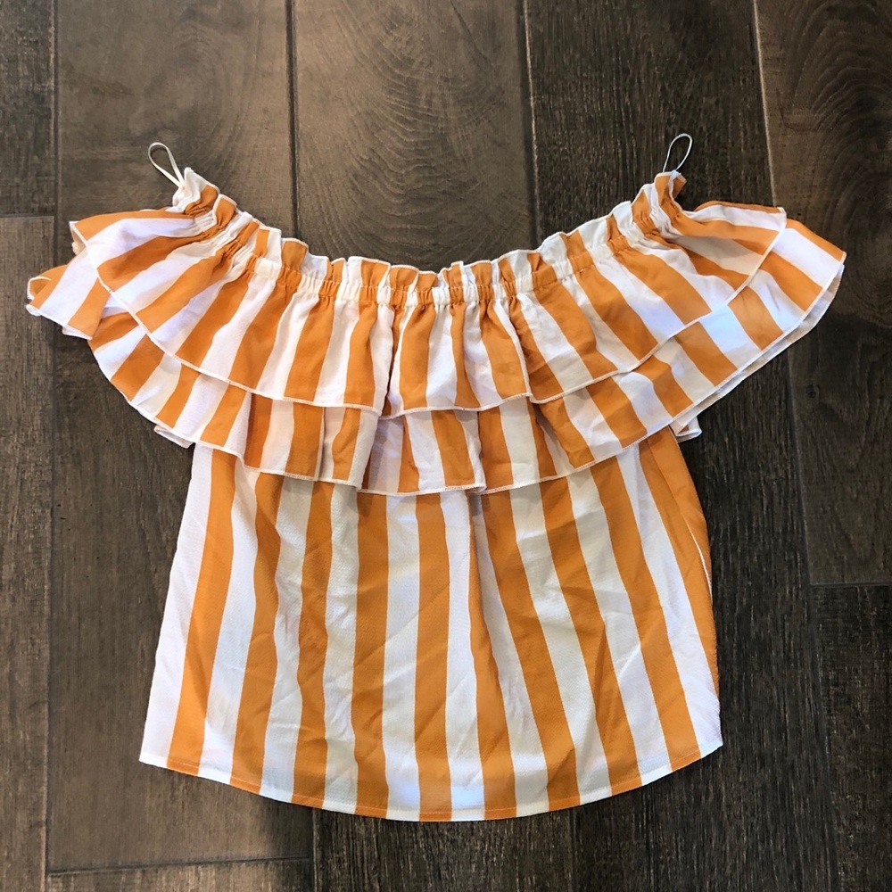 A. Calen by flying tomato off the shoulder top